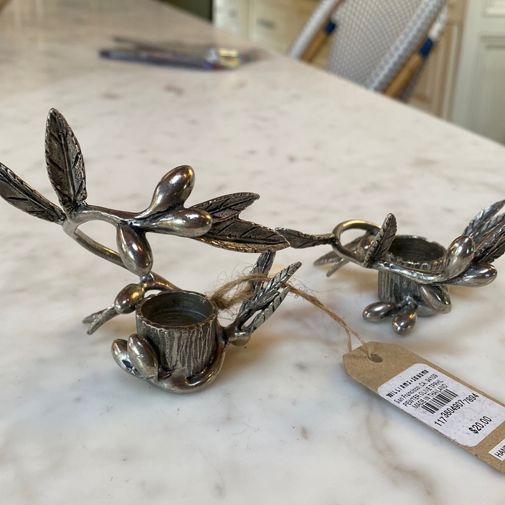 Two pewter olive branch taper candle holders